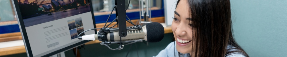 young professional talking on radio microphone
