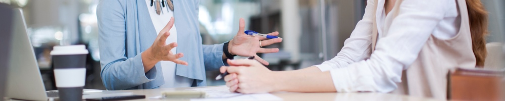 professionals having conversation at desk