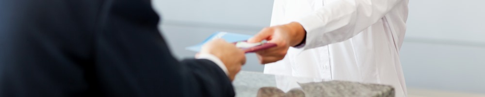 close up of man receiving plane ticket